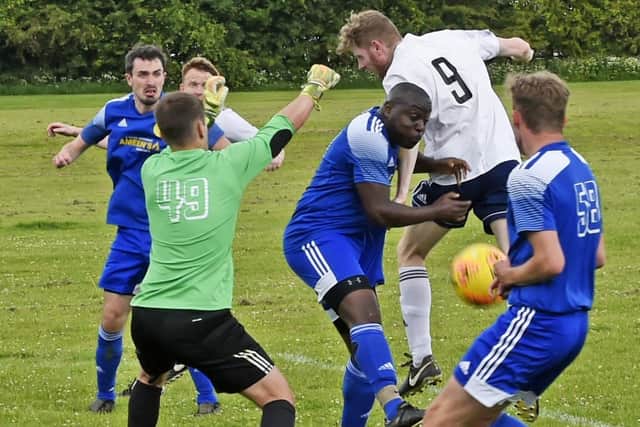 James Hawes, of Leeds City Res, causes havoc in the Horsforth St Margarets III goalmouth during Saturday's Yorkshire Amateur League Division 1 encounter. Picture: Steve Riding.