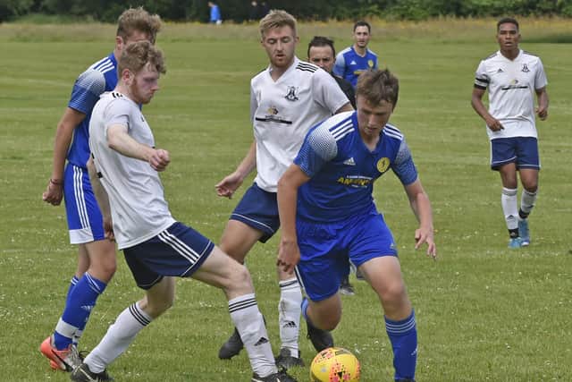 Yorkshire Amateur League Division 1: James Williams-Dustan wins the ball fror Horsforth St Margarets III at Leeds City Res. Picture: Steve Riding.