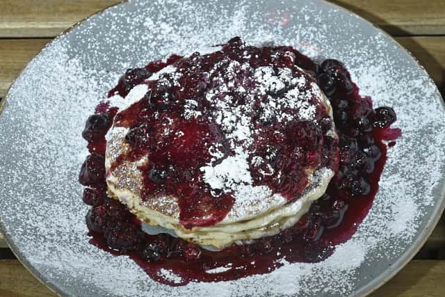 Fluffy American pancakes and berry compote is another tempting breakfast option.