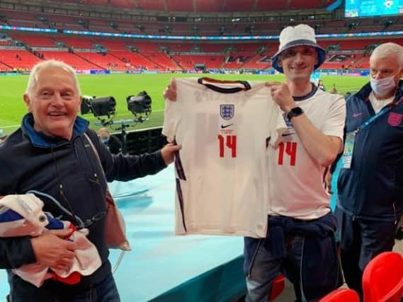 SPECIAL MEMENTO - Leeds United fan Adam Durnin and his dad Alan came away from Wembley with Kalvin Phillips' England shirt.