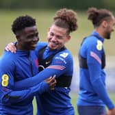 BOTH IN: Gary Neville believes Arsenal's Bukayo Saka, left, and Leeds United's Kalvin Phillips, right, should both start for England against Germany. Photo by Catherine Ivill/Getty Images.
