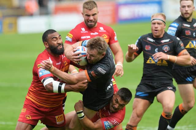 No go: Tigers captain Michael Shenton is stopped by the Dragons defence. Picture: Jonathan Gawthorpe