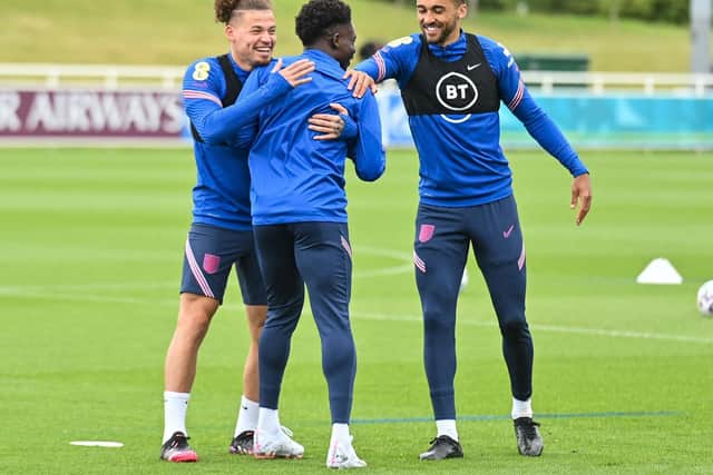 BACKING: Leeds United's England international midfielder Kalvin Phillips, left, with two of the Three Lions attacking players in Bukayo Saka, centre, and Dominic Calvert-Lewin, right, who is yet to feature. Photo by JUSTIN TALLIS/AFP via Getty Images.