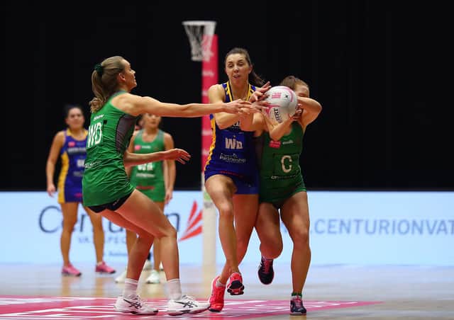 AIMING HIGH: Leeds Rhinos' Fi Toner, right, battles with Celtic Dragons' Christina Shaw, left, and Annika Lee-Jones during a Vitality Netball Superleague clash earlier this season. Picture: Jan Kruger/Getty Images for Vitality Netball Superleague