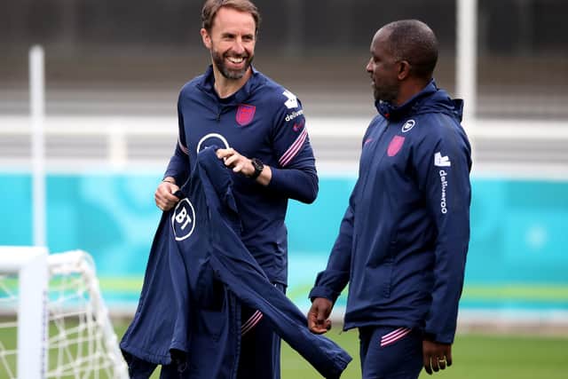 England manager Gareth Southgate during a training session at St George's Park with assistant coach Chris Powell. Picture: Nick Potts/PA