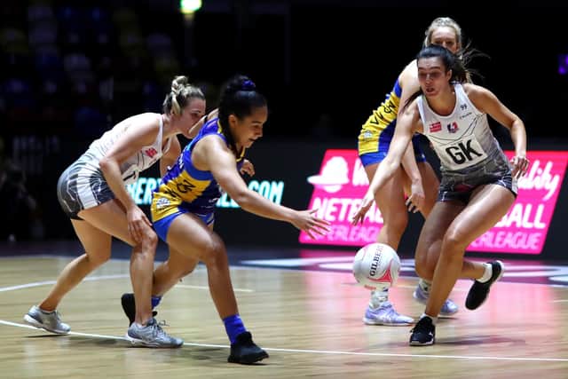 TOUGH GOING: Leeds Rhinos’ Brie Grierson, above left, Loughborough Lightning’s Sam May battle for posession at the Copper Box Arena.Picture: Chloe Knott/Getty Images