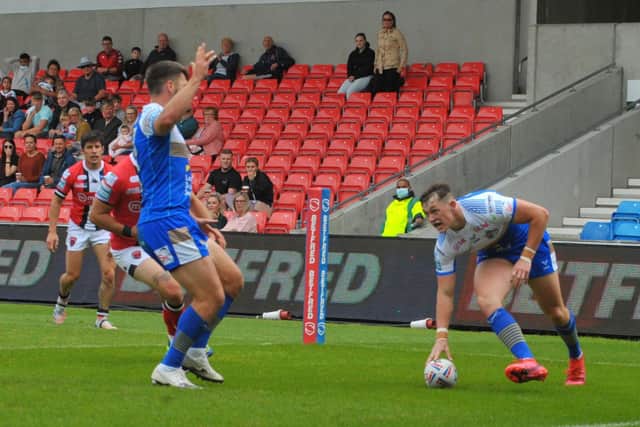 Try scorer Tom Briscoe, left, celebrates as Leeds Rhinos team-mate Jack Broadbent touches down in the 38-12 win at Salford Red Devils. Picture: Steve Riding.
