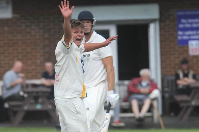 Pudsey St Lawrence's Charlie Parker celebrates after claiming the wicket of Farsley batsman Mathew Lumb - the fourth wicket of his five-wicket haul. Picture: Steve Riding.