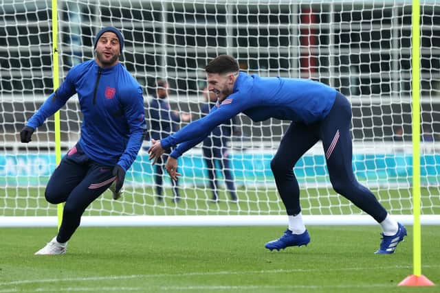 CATCH ME IF YOU CAN: Kyle Walker and Declan Rice of England play tag during Monday's training session at St George's Park. Picture: Eddie Keogh/Getty Images