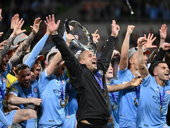 Patrick Kisnorbo celebrates his A-League title triumph with Melbourne City's players. Pic: Getty