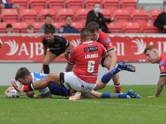 Richie Myler scores for Rhinos at Salford. Picture by Steve Riding.