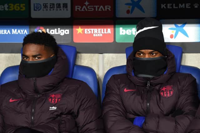 BIG MOVE - Junior Firpo and Nelson Semedo of FC Barcelona look on from the bench prior to the La Liga match against RCD Espanyol. Firpo, in need of a fresh start, is a target for Leeds United. Pic: Getty