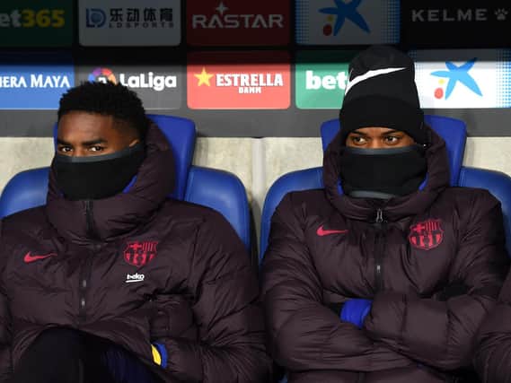 BIG MOVE - Junior Firpo and Nelson Semedo of FC Barcelona look on from the bench prior to the La Liga match against RCD Espanyol. Firpo, in need of a fresh start, is a target for Leeds United. Pic: Getty