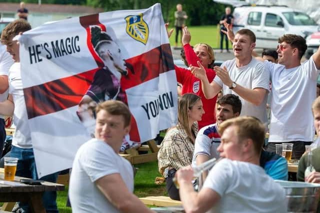 England have progressed to the quarter finals of Euro 2020 after a thrilling 2-0 victory over Germany at Wembley. Pictured: Fans at the Myrtle Tavern in Meanwood.
