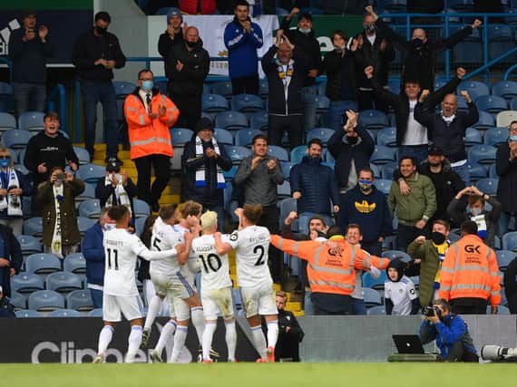 Leeds United fans celebrate with players on the final day of the season against West Brom. Pic: Getty