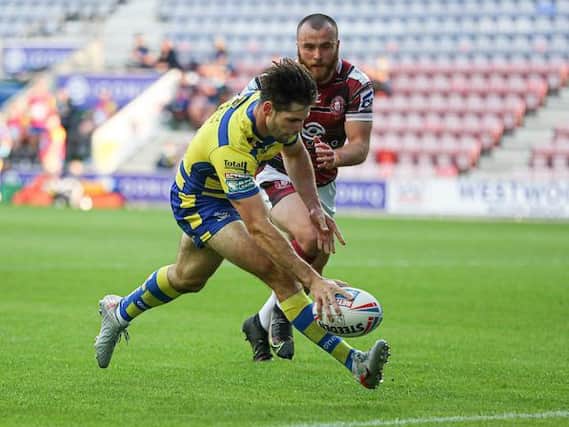 Jake Mamo scores for Warrington against Wigan on Wednesday. Picture by Paul Currie/SWpix.com.