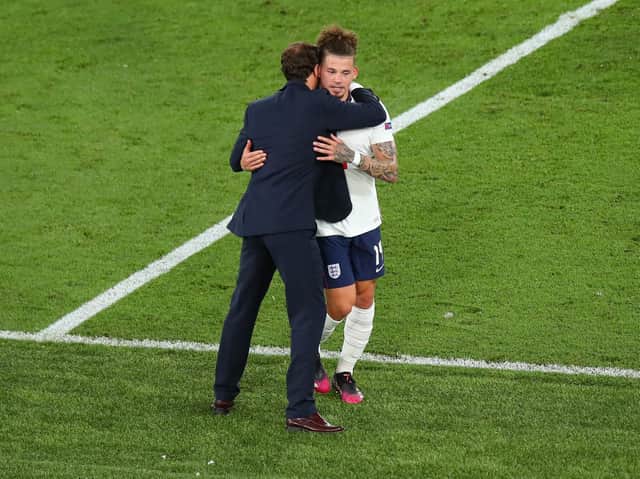 Leeds United's Kalvin Phillips is greeted by England boss Gareth Southgate as he is substituted against Ukraine. Pic: Getty