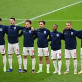 MIDFIELD PARTNERS: England duo Declan Rice, second left, and Kalvin Phillips, third left, are arm in arm for the national anthem prior to the group stages finale against Czech Republic at Wembley. Photo by Neil Hall - Pool/Getty Images.