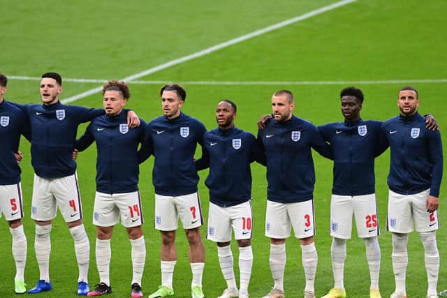 MIDFIELD PARTNERS: England duo Declan Rice, second left, and Kalvin Phillips, third left, are arm in arm for the national anthem prior to the group stages finale against Czech Republic at Wembley. Photo by Neil Hall - Pool/Getty Images.