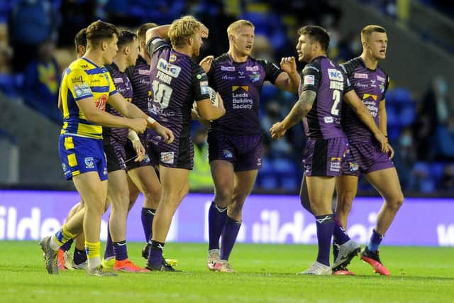 We've done it!: Leeds players celebrate the win over Warrington. Picture: Simon Hulme