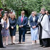 Lord Lieutenant of West Yorkshire Ed Anderson (second left) and Reverend Dr Jonathan Pritchard (right), greet relatives of Captain Sir Tom Moore