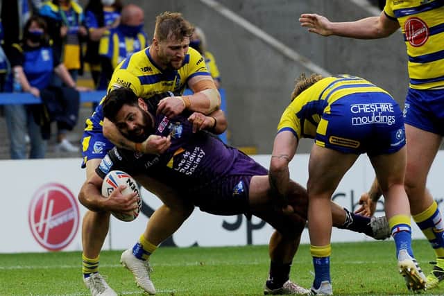 Rhyse Martin is held up by the Warrington defence. Picture: Simon Hulme.