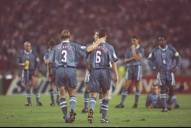 Stuart Pearce (left) consoles team-mate Gareth Southgate after his penalty miss during the Euro 96 semi-final (Picture: Ross Kinnaird/Allsport UK)