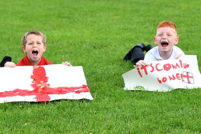 Year 2  pupils Harvey Tomlionson (left ) and Jack Daniel both aged 7  cheering England on to win the Euros.