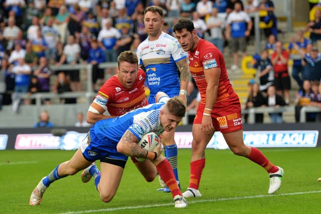 Sutty sweeps in: Rhinos' Liam Sutcliffe goes over to score his side's third try. Picture: Jonathan Gawthorpe