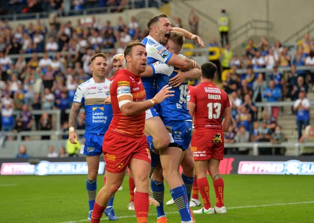 Captain's joy: Rhinos' Luke Gale celebrates with Liam Sutcliffe after he scored his side's third try.Picture: Jonathan Gawthorpe