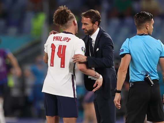Leeds United midfielder Kalvin Phillips embraces England head coach Gareth Southgate. Pic: Getty