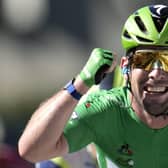Record equaller: Mark Cavendish celebrates winning his 34th stage of the Tour de France to pull alongside Eddy Merckx. Picture: Christophe Ena/AP