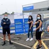Leeds players Matt Prior, left and James Donaldson, right, were vaccinated at Elland Road, along with women's team star Elle Frain, second from left and Rhinos netball ace Brie Grierson. Picture by Gary Longbottom.