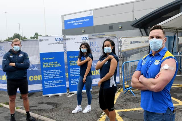 Leeds players Matt Prior, left and James Donaldson, right, were vaccinated at Elland Road, along with women's team star Elle Frain, second from left and Rhinos netball ace Brie Grierson. Picture by Gary Longbottom.