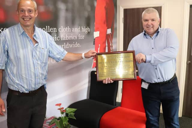 Adam Hainsworth, left, director of Hainsworth, pictured receiving the brass plaque for safe-keeping from Ronie Walsh, receptionist and keen historian at Leeds Teaching Hospitals NHS Trust.