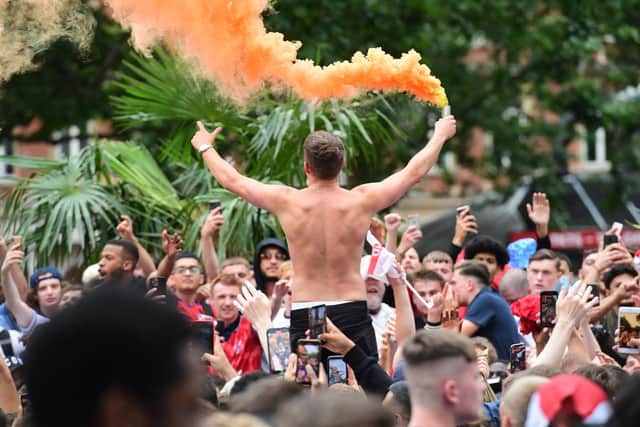 Fans gather in Leicester Square before the game tonight.
