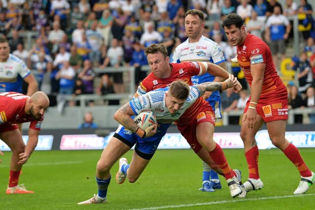Liam Sutcliffe goes over for a converted try which gave Leeds a 10-point half-time lead against Catalans last week. Picture by Jonathan Gawthorpe.