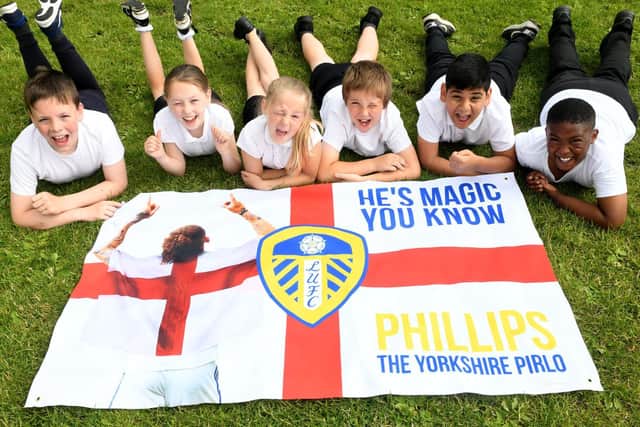 Pupils at Whingate Primary School cheer on former pupil Kalvin Phillips.