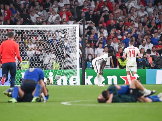WEMBLEY PAIN - England were beaten on penalties by Italy at Wembley in the Euro 2020 final. Leeds United's Kalvin Phillips consoled Bukayo Saka of Arsenal who missed from the spot. Pic: Getty