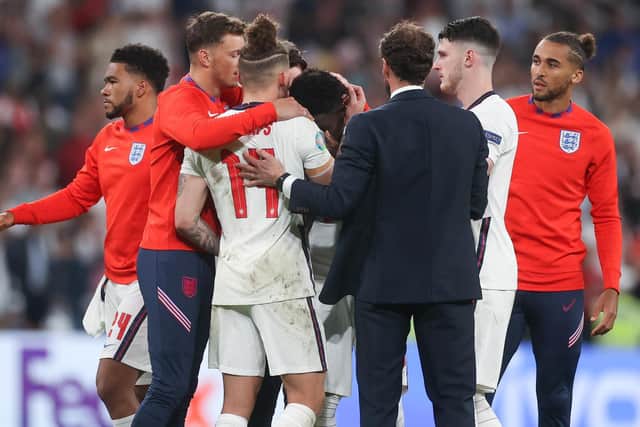 Leeds United's Kalvin Phillips comforts Bukayo Saka at Wembley. Pic: Getty