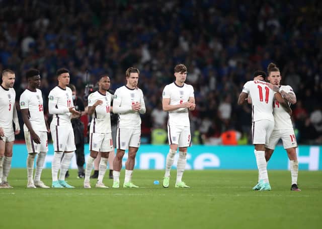 England's Marcus Rashford (2nd right) is consoled by Kalvin Phillips after missing in the penalty shoot-out at Wembley. Picture: Nick Potts/PA