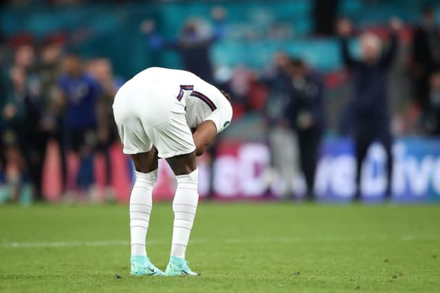 England's Marcus Rashford reacts after missing in the penalty shoot-out at Wembley. Picture: Nick Potts/PA