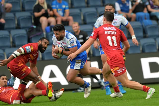 Rhyse Martin goes over to score Leeds Rhinos' opening try against Catalans Dragons last week. Martin will miss the rematch on Friday due to suspension. Picture: Jonathan Gawthorpe.