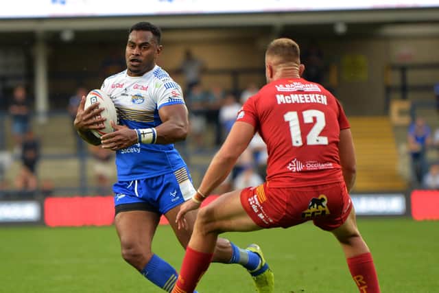 King Vuniyayawa takes on Catalans Dragons' Mike McMeeken last week. The Fijian international is keen to stay on at the Rhinos. Picture: Jonathan Gawthorpe.