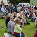 Visitors to the first day of the show relax in the fine weather to watch the showjumping in the main ring. Picture Tony Johnson.