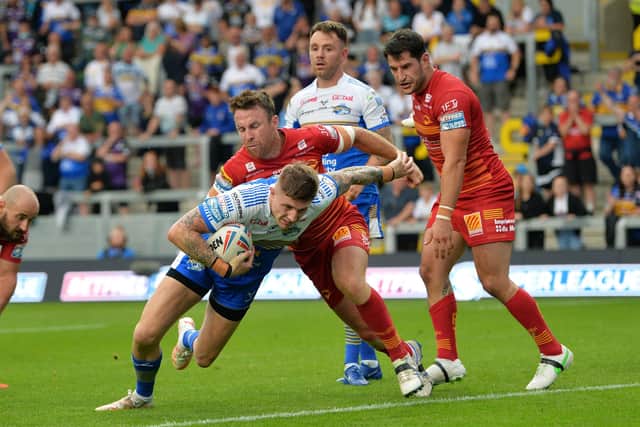 Liam Sutcliffe goes over to score Leeds Rhinos' third try against Catalans Dragons last week. 
Picture: Jonathan Gawthorpe.