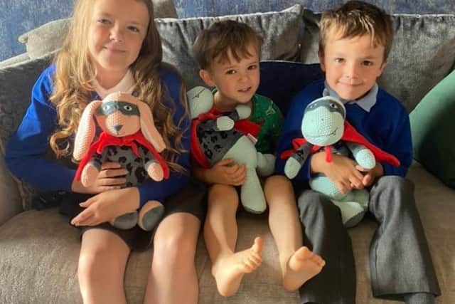 Taken the day before he left for Alder Hey, Archie is pictured with his older sister Lily and older brother Harry.