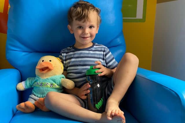 Archie in hospital with his chemo duck.