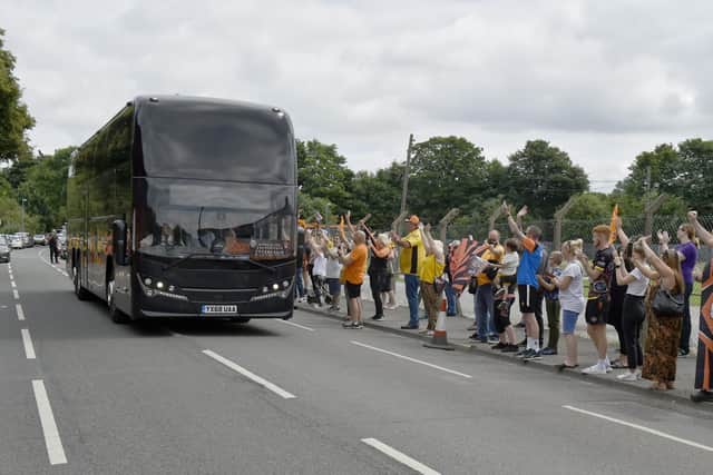 Fans cheer Tigers on their way to Wembley. Picture by Steve Riding.