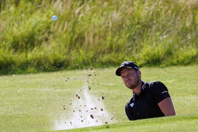 England's Danny Willett chips out of a bunker on the 6th. Picture: PA